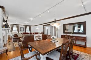 a living room with a table and a couch at - King Bed - Massive Yard - Fully Equipped Condo in Geneva