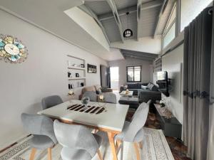 a living room with a table and chairs at Villa Beka in Sarandë