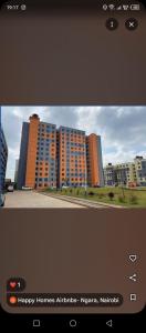 a television screen with a picture of a city at Maggies suites and Bnb in Nairobi
