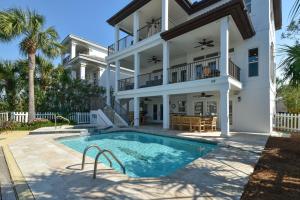 an exterior view of a house with a swimming pool at Casa Di Amore in Destin