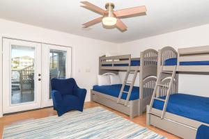a bedroom with two bunk beds and a ceiling fan at Casa Di Amore in Destin +32 photos