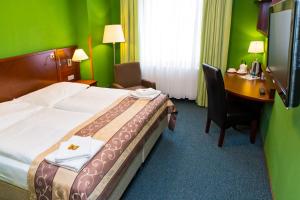 Postel nebo postele na pokoji v ubytování Hotel Rieger Garni