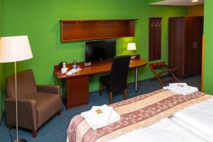 Postel nebo postele na pokoji v ubytování Hotel Rieger Garni