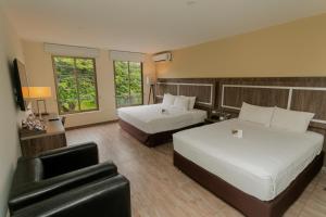 Postel nebo postele na pokoji v ubytování Rado Hotel - Quintanas