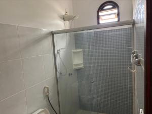 a bathroom with a shower with a glass door at Casa da Ilha de Boipeba in Ilha de Boipeba +28 photos