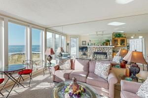 a living room with a couch and a table at Ocean Star in Depoe Bay