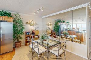 a dining room with a table and some plants at Ocean Star in Depoe Bay