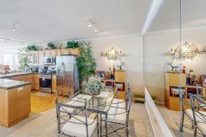 a kitchen and dining room with a table and chairs at Ocean Star in Depoe Bay