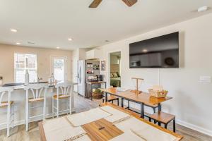 a kitchen and living room with a table and a counter at Near Golf Courses Cozy Home in Ocean Isle Beach! in Ocean Isle Beach