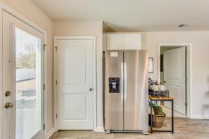 a kitchen with a stainless steel refrigerator at Near Golf Courses Cozy Home in Ocean Isle Beach! in Ocean Isle Beach