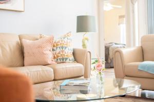 a living room with a couch and a coffee table at Super Mario Hideaway - Pool, Spa, Game Room Fun! in Davenport