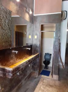 a bathroom with a sink and a toilet in it at centro cultural da flor in Salvador