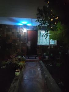 a dark room with a blue light in a house at Casa Isis in Constitución