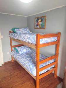 a bedroom with two bunk beds in a room at Casa Isis in Constitución