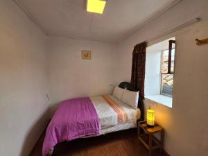 Postel nebo postele na pokoji v ubytování Barrio Inka B&B