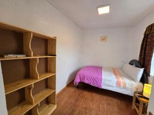 Postel nebo postele na pokoji v ubytování Barrio Inka B&B