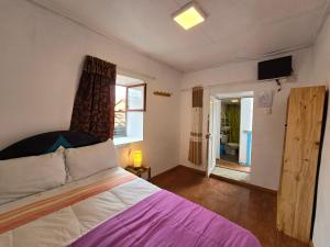 Postel nebo postele na pokoji v ubytování Barrio Inka B&B