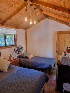 Postel nebo postele na pokoji v ubytování Cabañitas Remanso del Espíritu