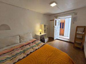 Postel nebo postele na pokoji v ubytování Barrio Inka B&B