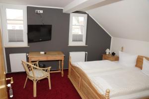 Postel nebo postele na pokoji v ubytování Hotel Deutsches Haus