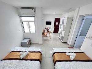 Postel nebo postele na pokoji v ubytování Hotel Đông Nhi