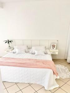 Postel nebo postele na pokoji v ubytování Residencial Baía Norte