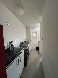 Η κουζίνα ή μικρή κουζίνα στο Departamento equipado 302 Ovalle