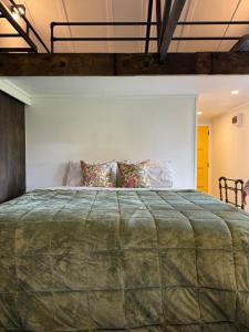 a bedroom with a large bed in a room at Five Paddocks Tamahere in Tamahere +10 photos