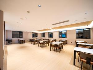 Restaurace v ubytování 桔作酒店（郑州经开中原福塔东地铁站店） + 37 fotografií