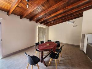 a dining room with a table and chairs at Morada del Viento in Humahuaca