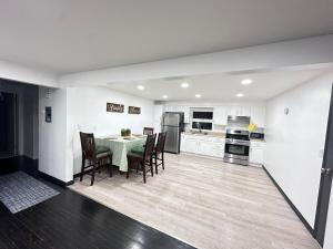 a kitchen and dining room with a table and chairs at 30minNYC 15minEWR10minDreamMall in Belleville