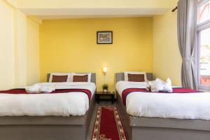 Postel nebo postele na pokoji v ubytování Thamel Hotel & Spa