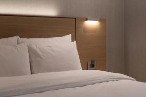 Postel nebo postele na pokoji v ubytování Hotel Suop