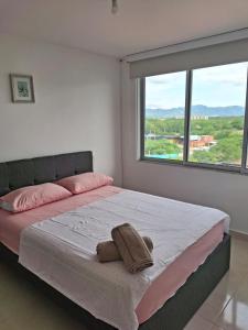 Ένα ή περισσότερα κρεβάτια σε δωμάτιο στο Estrene lindo y cómodo apartamento +55 φωτογραφίες