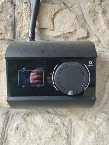 a electrical outlet on a stone wall with a hand in it at Męcikówka in Szczyrk +17 photos