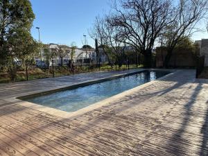 a swimming pool in the middle of a park at Appartement T2 avec grande terrasse et parking - FR-1-553-291 in Balaruc-les-Bains +9 photos