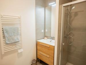 a bathroom with a shower and a sink and a shower at Bel Appartement T2 Neuf avec Terrasse - FR-1-553-292 in Balaruc-les-Bains +8 photos