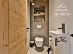 a bathroom with a toilet and a sink at Chalet au Grand Bornand – 6 Chambres Spacieuses & Ambiance Chaleureuse - FR-1-391-194 in Le Grand-Bornand +27 photos