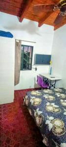 Giường trong phòng chung tại Telepostal