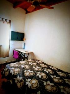 Giường trong phòng chung tại Telepostal