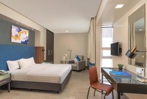 Postel nebo postele na pokoji v ubytování Greenhills Elan Hotel Modern - Newly Renovated