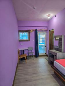 Ένα ή περισσότερα κρεβάτια σε δωμάτιο στο Wen Zhong Hostel