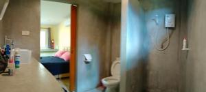 a bathroom with a shower and a toilet at Alisa Bungalows in Ko Chang +21 photos