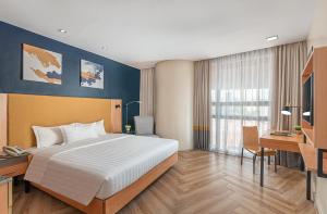 Postel nebo postele na pokoji v ubytování Greenhills Elan Hotel Modern - Newly Renovated
