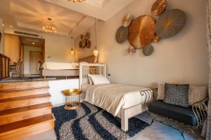a bedroom with two beds and a living room at Ocean Pearl Seaview Residence in Rawai Beach +207 photos