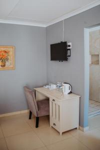 Μια τηλεόραση ή/και κέντρο ψυχαγωγίας στο Karabelo guesthouse