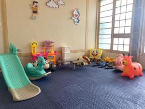 a room with many different types of toys in it at The Onsen Hot Spring Resort in Batu