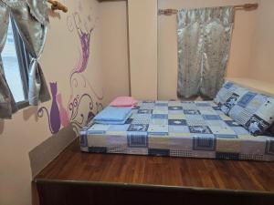 Ένα ή περισσότερα κρεβάτια σε δωμάτιο στο Wen Zhong Hostel
