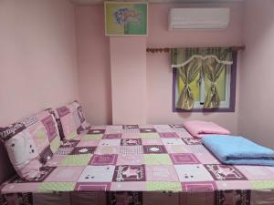 Ένα ή περισσότερα κρεβάτια σε δωμάτιο στο Wen Zhong Hostel