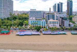 a view of a beach with flowers in the sand at Wave Hotel Pattaya in Pattaya